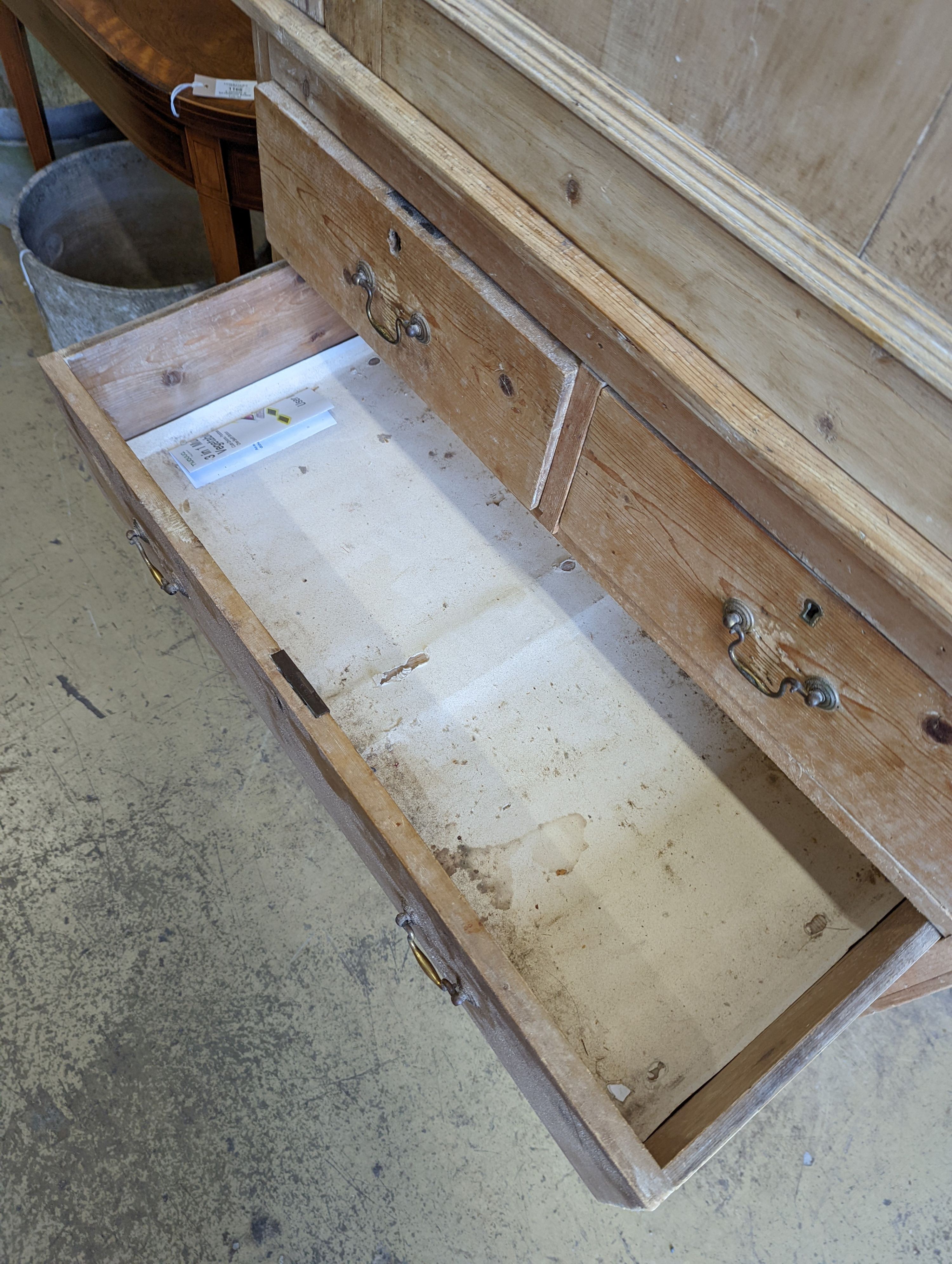 An Edwardian pine kitchen cupboard with five drawer base, width 94cm, height 193cm